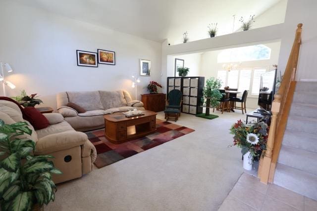 1976 Decatur Ave, Clovis, CA 93611 - living area with carpet flooring, high vaulted ceiling, and a chandelier