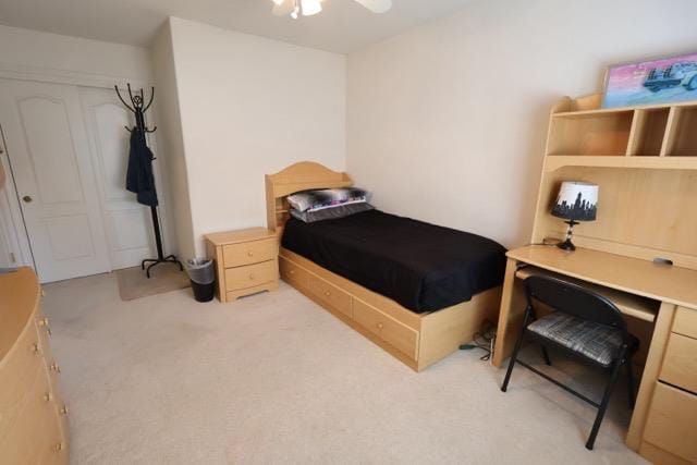 1976 Decatur Ave, Clovis, CA 93611 - bedroom featuring light carpet, a ceiling fan, and a desk