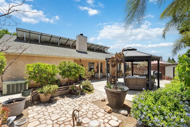 5860 W Menlo Ave, Fresno, CA 93722 - view of patio / terrace featuring a gazebo, a grill, an outdoor living space, and cooling unit