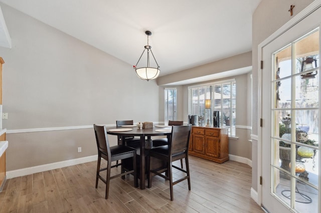 5860 W Menlo Ave, Fresno, CA 93722 - dining area with light wood-type flooring and baseboards