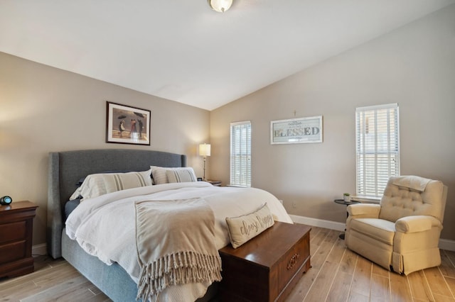 5860 W Menlo Ave, Fresno, CA 93722 - bedroom with light wood-style floors, vaulted ceiling, and baseboards