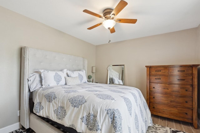 5860 W Menlo Ave, Fresno, CA 93722 - bedroom with wood finished floors, a ceiling fan, and baseboards