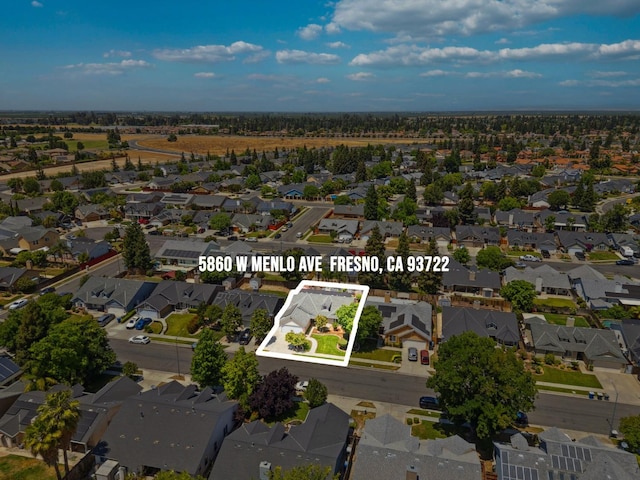 5860 W Menlo Ave, Fresno, CA 93722 - aerial view of property's location with nearby suburban area and property parcel outlined