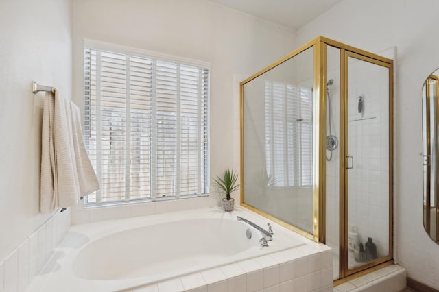 5860 W Menlo Ave, Fresno, CA 93722 - bathroom featuring plenty of natural light, a garden tub, and a stall shower