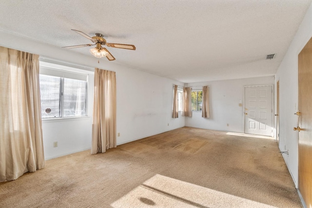 4782 W Austin Way, Fresno, CA 93722 - unfurnished room with carpet floors, ceiling fan, and a textured ceiling
