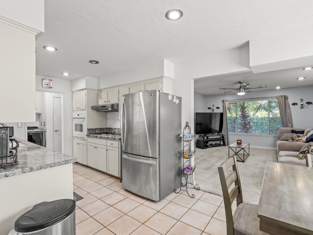 7352 N Adoline Ave, Fresno, CA 93711 - kitchen featuring stainless steel appliances, under cabinet range hood, open floor plan, ceiling fan, and light tile patterned flooring