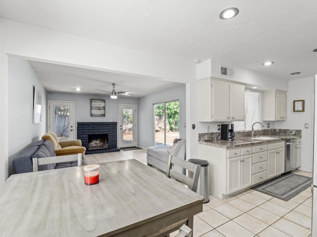 7352 N Adoline Ave, Fresno, CA 93711 - dining room featuring light tile patterned flooring, a fireplace, ceiling fan, and recessed lighting