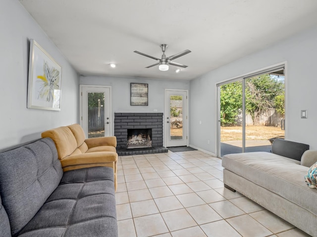 7352 N Adoline Ave, Fresno, CA 93711 - living room featuring a ceiling fan, light tile patterned flooring, a fireplace, and baseboards