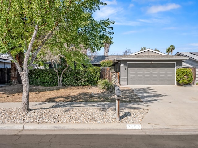 7352 N Adoline Ave, Fresno, CA 93711 - view of front facade with a garage and driveway