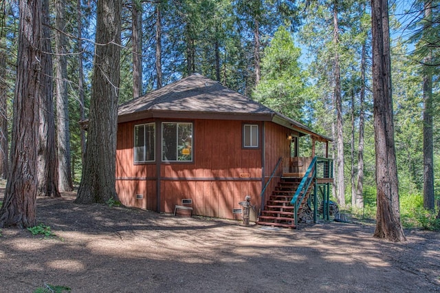 42272 Hanging Branch Rd, Shaver Lake, CA 93664 - view of property exterior with crawl space, stairway, and a shingled roof