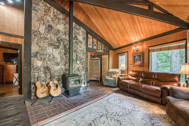 42272 Hanging Branch Rd, Shaver Lake, CA 93664 - living room featuring a wood stove, high vaulted ceiling, wood finished floors, wooden ceiling with exposed beams, and wood walls