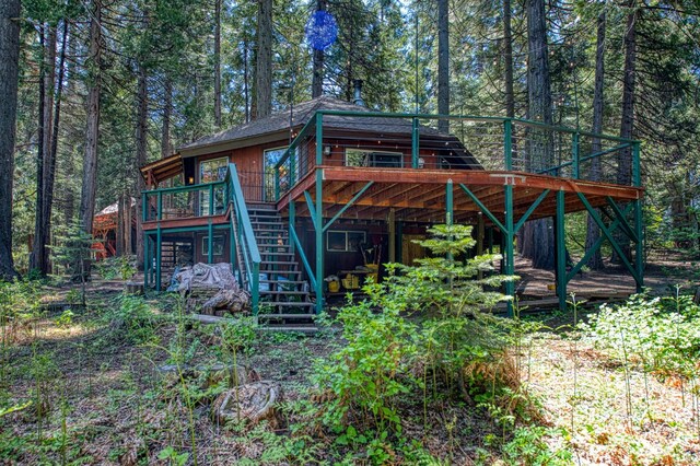 42272 Hanging Branch Rd, Shaver Lake, CA 93664 - rear view of house with stairway, a deck, and a forest view