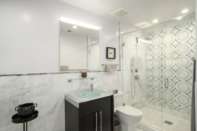 5309 N Parrish Way, Fresno, CA 93711 - full bathroom featuring vanity, toilet, a shower stall, and tile walls