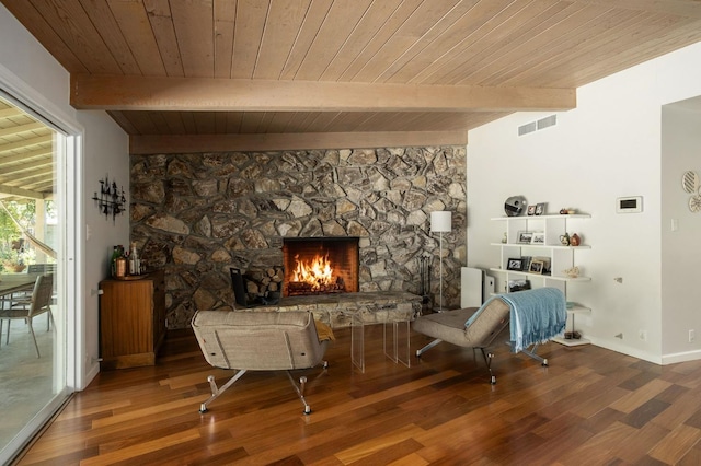 5309 N Parrish Way, Fresno, CA 93711 - sitting room featuring wooden ceiling with exposed beams, a stone fireplace, wood finished floors, and baseboards