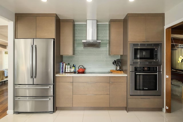 5309 N Parrish Way, Fresno, CA 93711 - kitchen featuring appliances with stainless steel finishes, light countertops, wall chimney exhaust hood, recessed lighting, and backsplash