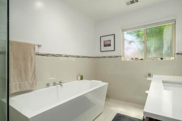5309 N Parrish Way, Fresno, CA 93711 - bathroom with vanity, a freestanding tub, tile patterned floors, and toilet