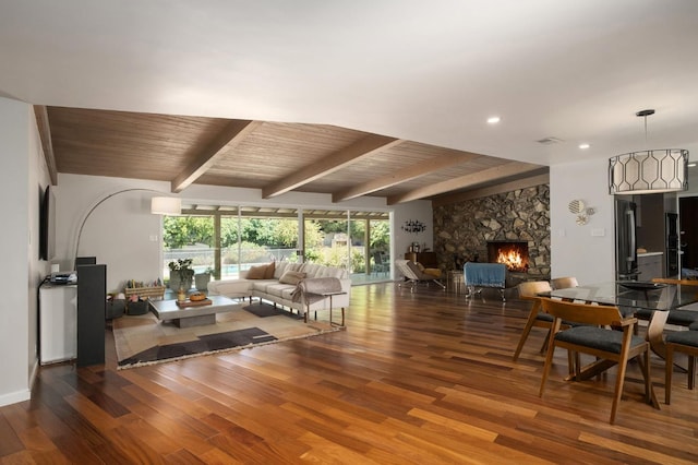 5309 N Parrish Way, Fresno, CA 93711 - living area featuring wood finished floors, a stone fireplace, wooden ceiling with exposed beams, and recessed lighting