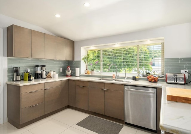 5309 N Parrish Way, Fresno, CA 93711 - kitchen featuring stainless steel dishwasher, a sink, backsplash, light countertops, and lofted ceiling