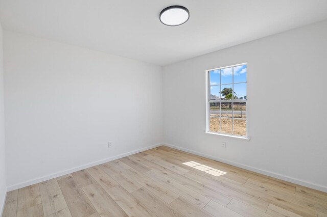 20434 Olympia Rd, Madera, CA 93638 - empty room with wood finished floors and baseboards