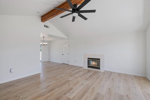 20434 Olympia Rd, Madera, CA 93638 - unfurnished living room featuring a ceiling fan, a chandelier, a premium fireplace, light wood-type flooring, and baseboards
