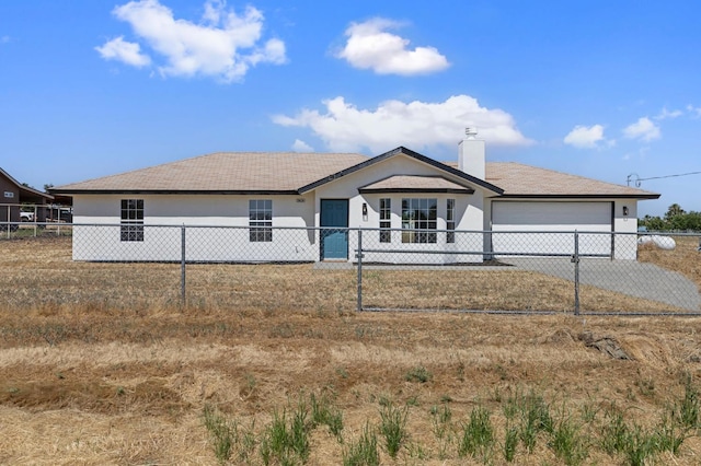 20434 Olympia Rd, Madera, CA 93638 - single story home featuring a garage, driveway, a chimney, and stucco siding