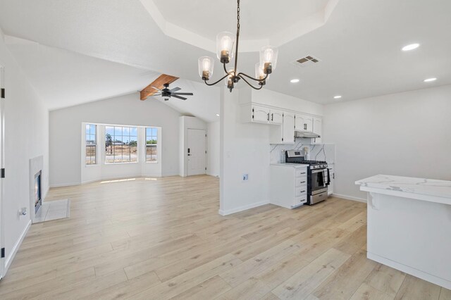 20434 Olympia Rd, Madera, CA 93638 - kitchen with gas range, ceiling fan, light wood-style flooring, light countertops, and recessed lighting
