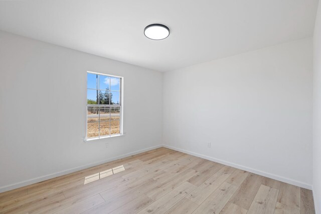 20434 Olympia Rd, Madera, CA 93638 - unfurnished room with wood finished floors and baseboards