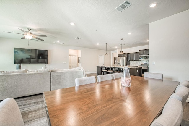 574 Expedition Way, Madera, CA 93636 - dining space featuring ceiling fan, recessed lighting, and baseboards