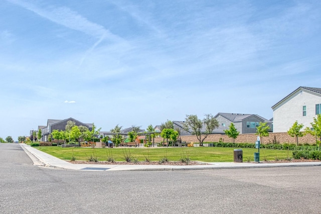 574 Expedition Way, Madera, CA 93636 - view of asphalt street featuring curbs, sidewalks, and a residential view