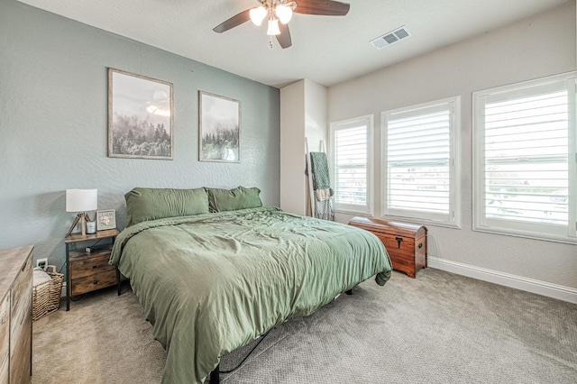 574 Expedition Way, Madera, CA 93636 - bedroom featuring multiple windows, light colored carpet, baseboards, a ceiling fan, and a textured wall