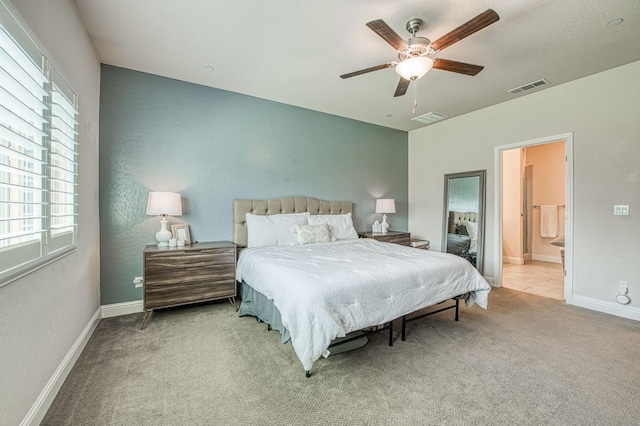 574 Expedition Way, Madera, CA 93636 - carpeted bedroom featuring multiple windows, baseboards, a ceiling fan, and ensuite bathroom