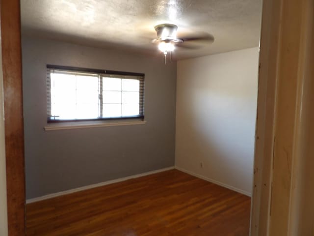 4321 Buckingham Way, Fresno, CA 93726 - spare room with wood finished floors and a ceiling fan
