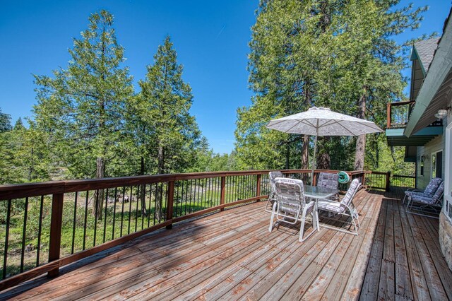 42010 Granite Ledge Ln, Shaver Lake, CA 93664 - wooden deck featuring outdoor dining area