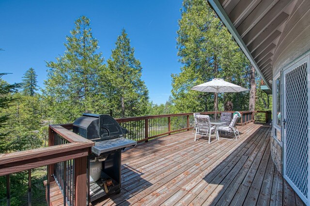 42010 Granite Ledge Ln, Shaver Lake, CA 93664 - wooden terrace with outdoor dining space and a grill