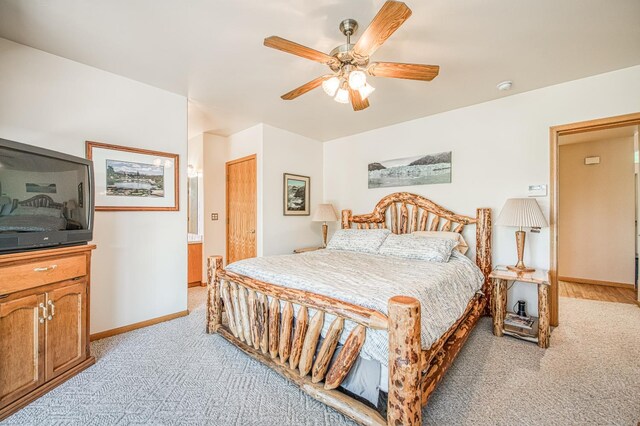 42010 Granite Ledge Ln, Shaver Lake, CA 93664 - bedroom with light carpet, baseboards, and ceiling fan
