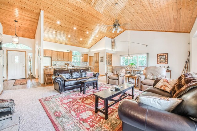 42010 Granite Ledge Ln, Shaver Lake, CA 93664 - living room featuring wood ceiling, a ceiling fan, high vaulted ceiling, light carpet, and a chandelier