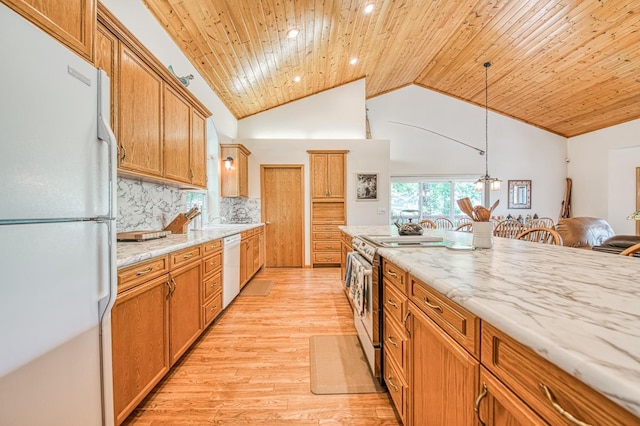 42010 Granite Ledge Ln, Shaver Lake, CA 93664 - kitchen featuring white appliances, light wood finished floors, tasteful backsplash, hanging light fixtures, and wooden ceiling