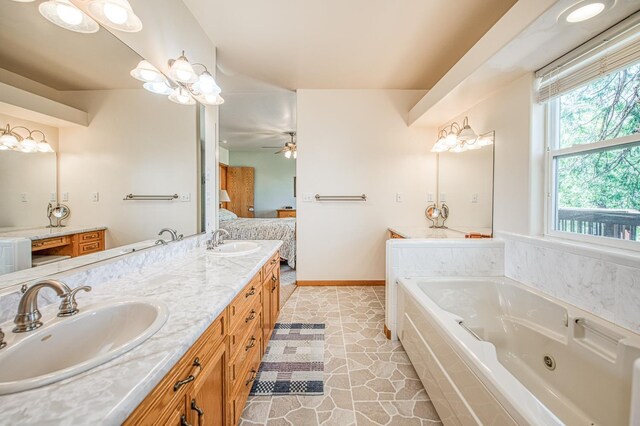 42010 Granite Ledge Ln, Shaver Lake, CA 93664 - ensuite bathroom featuring a whirlpool tub, double vanity, ceiling fan, and tile patterned floors