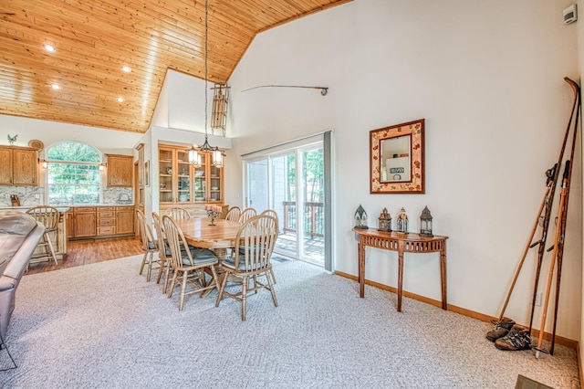 42010 Granite Ledge Ln, Shaver Lake, CA 93664 - dining space featuring wooden ceiling, high vaulted ceiling, light colored carpet, recessed lighting, and baseboards