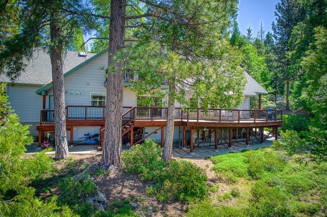 42010 Granite Ledge Ln, Shaver Lake, CA 93664 - rear view of house featuring stairway, a deck, and roof with shingles