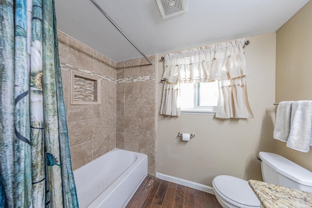 1096 Twain Ave W, Fresno, CA 93711 - bathroom with toilet, shower / bath combination with curtain, baseboards, and wood finished floors