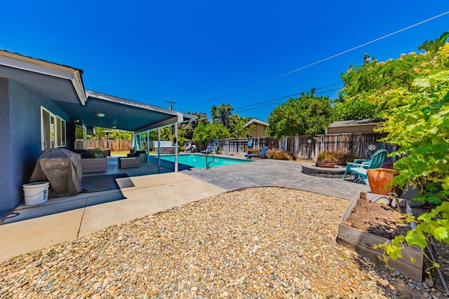 1096 Twain Ave W, Fresno, CA 93711 - view of pool with an outdoor living space with a fire pit, a patio, and a fenced backyard