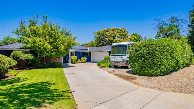 1096 Twain Ave W, Fresno, CA 93711 - view of front of property featuring a front lawn, roof mounted solar panels, and concrete driveway