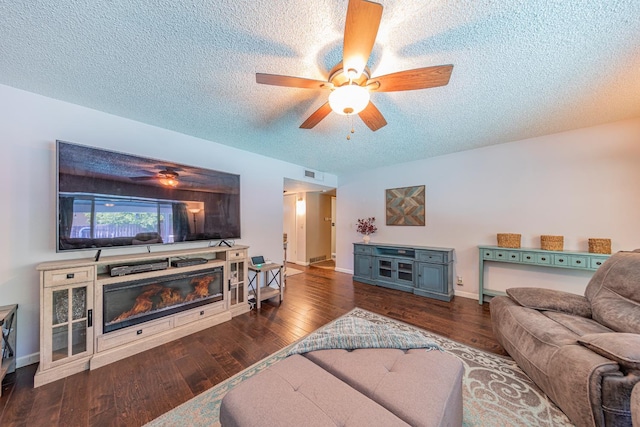1096 Twain Ave W, Fresno, CA 93711 - living area featuring ceiling fan, a textured ceiling, wood finished floors, baseboards, and a glass covered fireplace