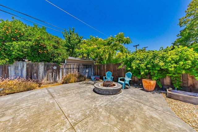 1096 Twain Ave W, Fresno, CA 93711 - fenced backyard featuring a fire pit and a patio