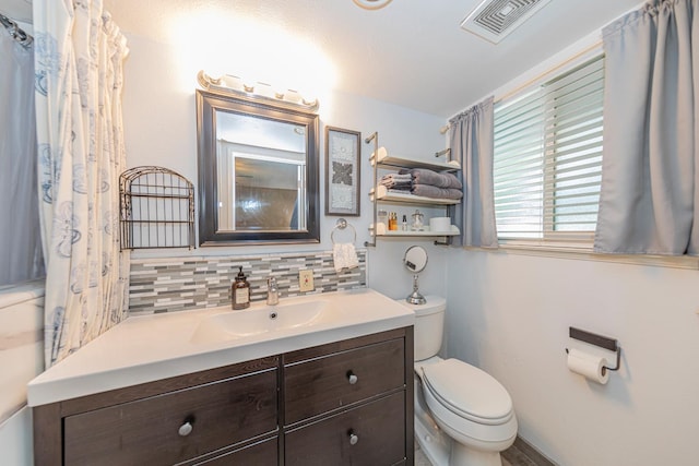 1096 Twain Ave W, Fresno, CA 93711 - bathroom with toilet, decorative backsplash, and vanity