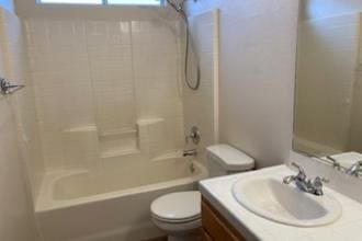 9872 N Woodrow Ave, Fresno, CA 93720 - bathroom with toilet, vanity, and washtub / shower combination