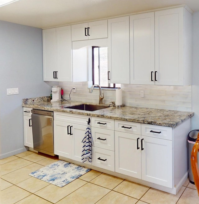 33491 Rd 233, North Fork, CA 93643 - kitchen featuring stainless steel dishwasher, a sink, light stone countertops, baseboards, and white cabinets