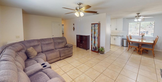 33491 Rd 233, North Fork, CA 93643 - living room with ceiling fan, light tile patterned floors, and baseboards