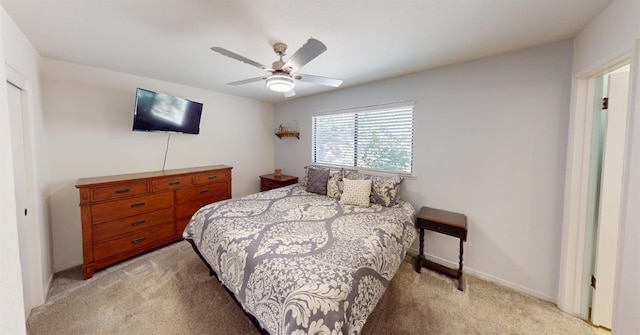 33491 Rd 233, North Fork, CA 93643 - bedroom with light colored carpet, a ceiling fan, and baseboards